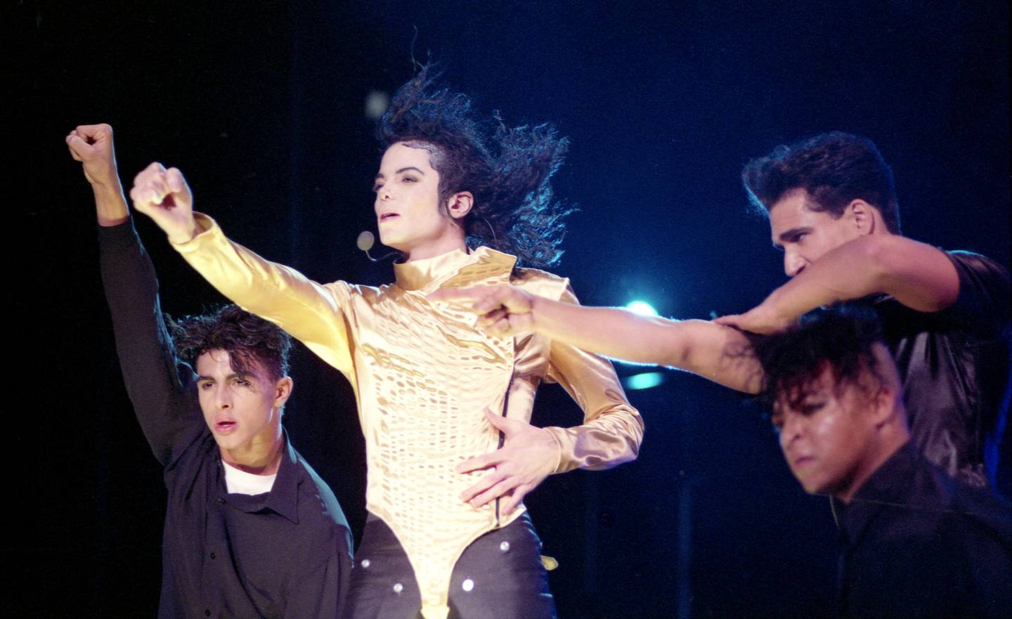 American pop star Michael Jackson performs with background singers during a concert in Munich's, southern Germany, Olympic stadium on Saturday, June 26, 1992. (AP Photo/Arne Dedert)