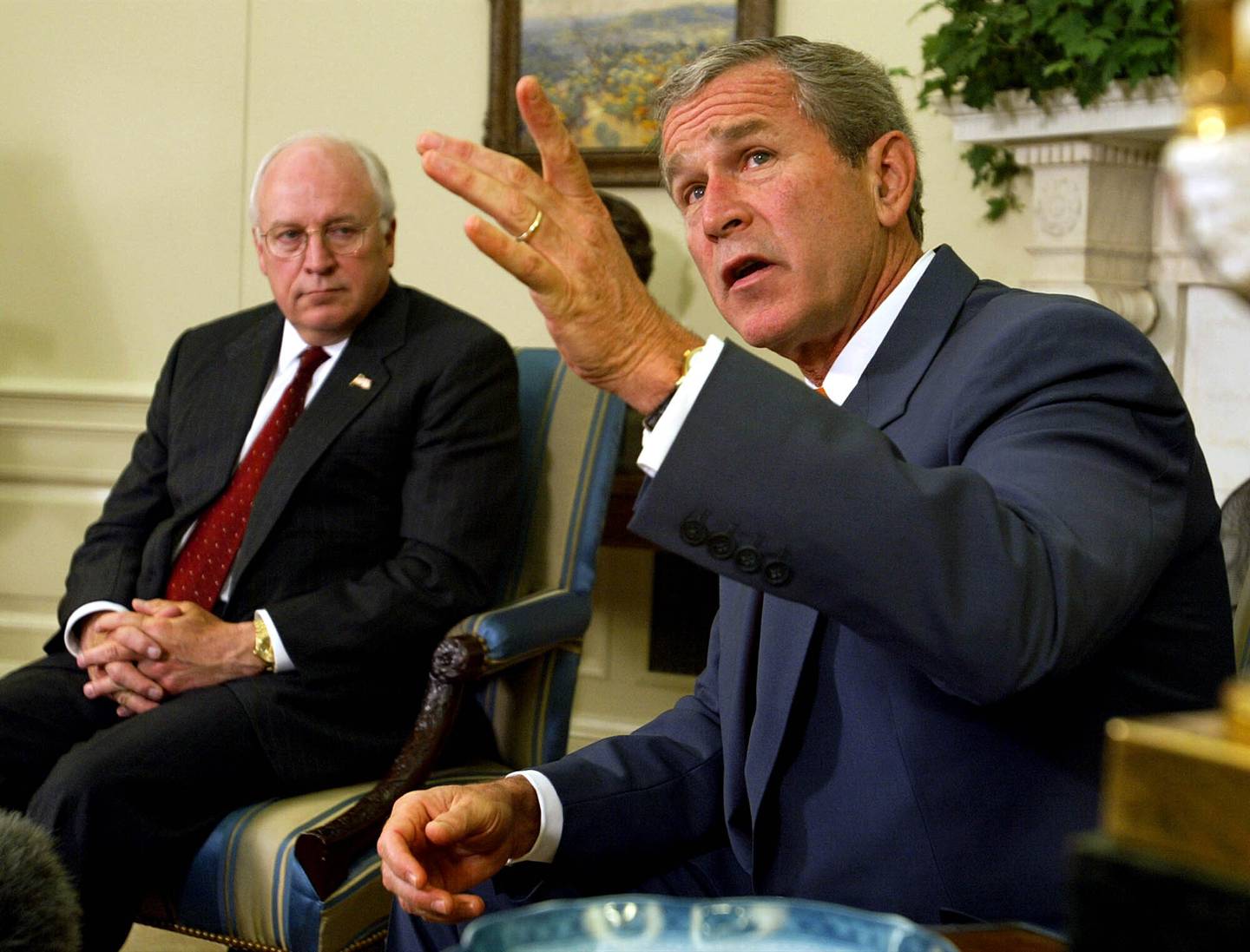 FILE - President George W. Bush, right, with Vice President Dick Cheney at his side, speaks during a meeting with congressional leaders in the White House Oval Office on Sept. 18, 2002. A new CNN Films documentary explores the role of the U.S. vice presidency, which in modern times has emerged into a more powerful position. Still, the film notes that  a veep’s duties are all up to the president. (AP Photo/Doug Mills, File)