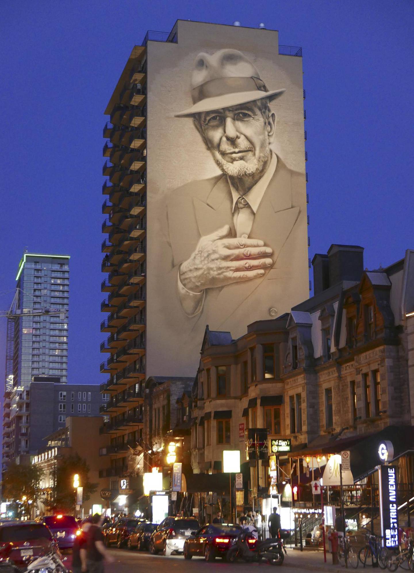Leonard Cohens portrett på en vegg i hjembyen Montreal.  Foto: Eric Thomas/AFP/NTB Scanpix