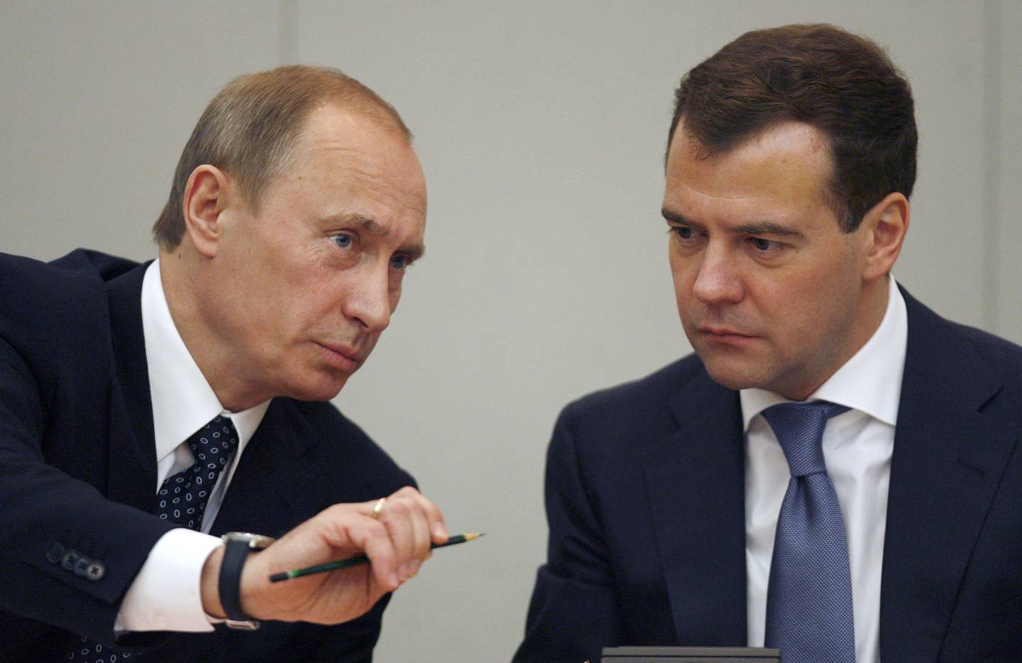 FILE - Russian President Dmitry Medvedev, right, listens to Russian former president Vladimir Putin, during a discussion in the State Duma, lower parliament chamber, in Moscow on May 8, 2008. Barred by the constitution from running for a third consecutive term, Putin is appointed prime minister by new President Dmitry Medvedev but effectively remains Russia's political leader. (AP Photo/ Mikhail Metzel, Pool, File)