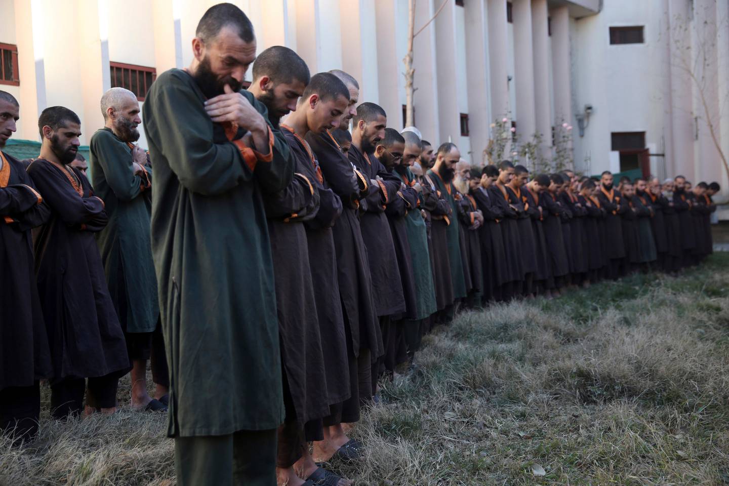 Islamic State militants either arrested or surrounded to the Afghan government are presented to media in Kabul, Afghanistan, Saturday, Dec. 21, 2019.  The country's intelligence service says Saturday that there are more than 75 women and 159 children most of them form foreign countries in the custody of the agency known as the National Deteriorate for Security.  (AP Photo/Rahmat Gul)