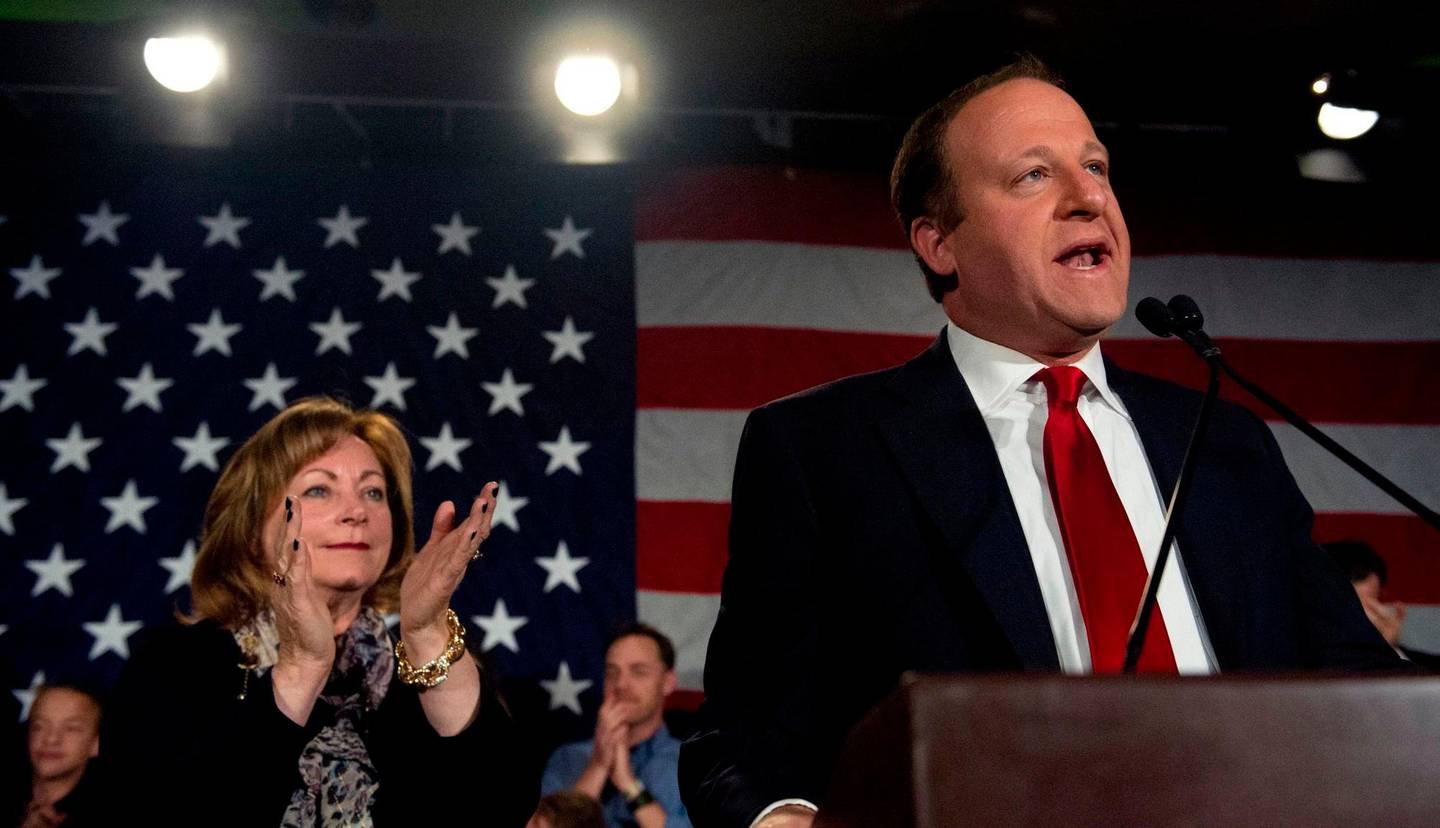 U.S. Representative Jared Polis (D) and Dianne Primavera (L) address supporters after their campaign victory in the Colorado gubernatorial race during the Colorado Democrats watch party in Denver, Colorado on November 6, 2018. - Democratic Congressman Jared Polis has won the governor's race in Colorado, networks projected on Tuesday, making him the first openly gay person to be elected as a US governor. (Photo by Jason Connolly / AFP)