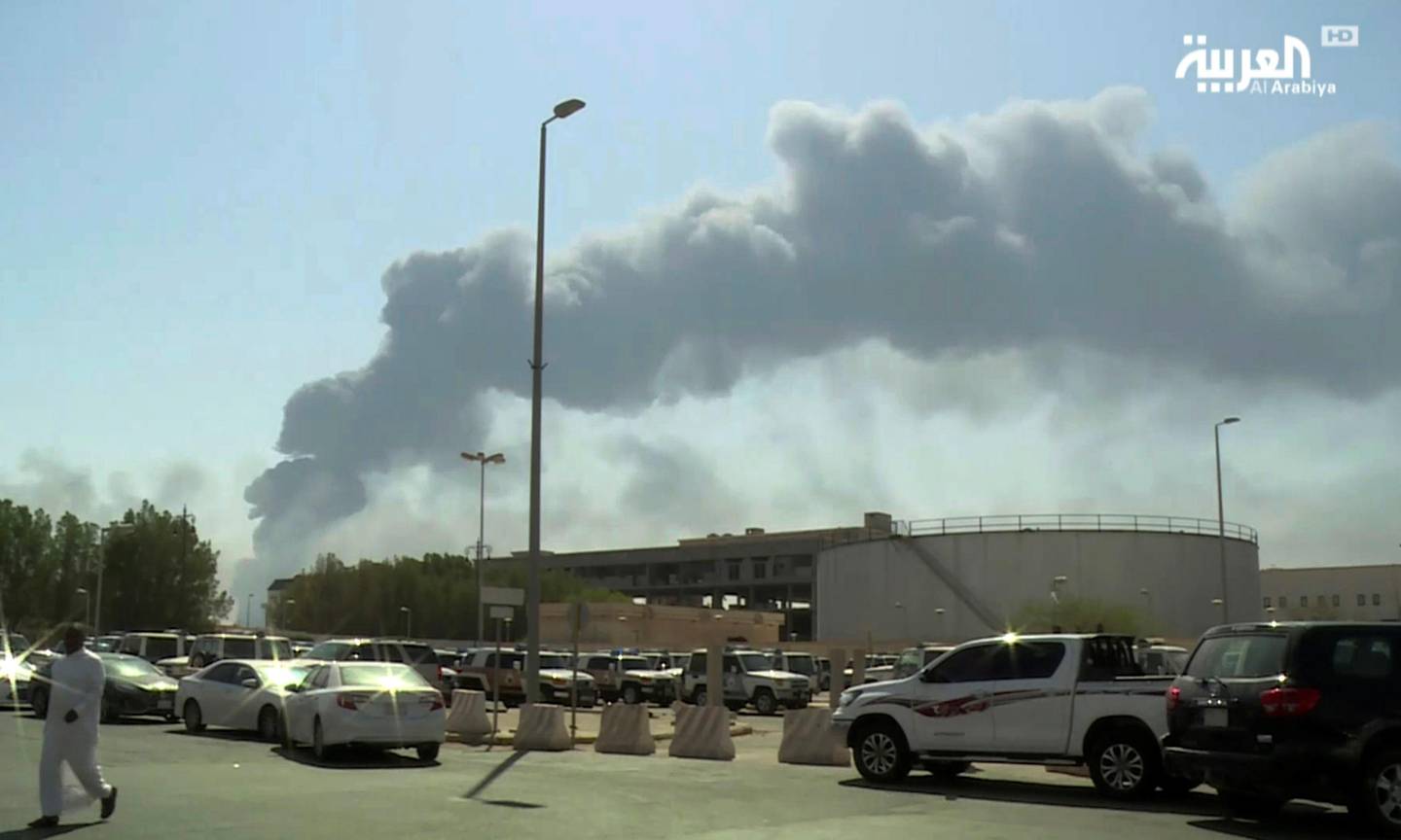FILE - In this Saturday, Sept. 14, 2019 file photo, made from a video broadcast on the Saudi-owned Al-Arabiya satellite news channel, smoke from a fire at the Abqaiq oil processing facility fills the skyline, in Buqyaq, Saudi Arabia. The weekend drone attack on one of the worlds largest crude oil processing plants that dramatically cut into global oil supplies is the most visible sign yet of how Aramcos stability and security is directly linked to that of its owner -- the Saudi government and its ruling family. (Al-Arabiya via AP, File)