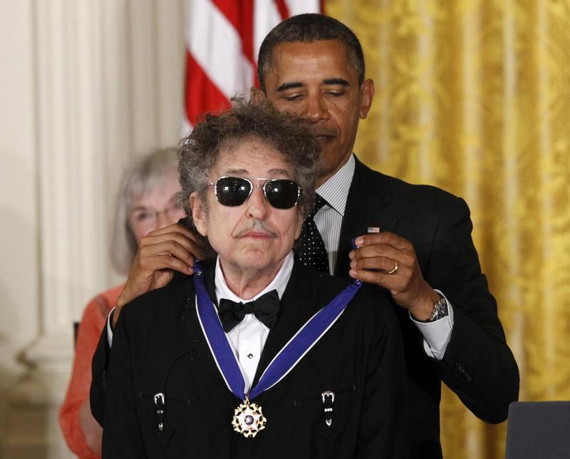 FILE - In this May 29, 2012, file photo, President Barack Obama presents rock legend Bob Dylan with a Medal of Freedom during a ceremony at the White House in Washington. Dylan won the 2016 Nobel Prize in literature, announced Thursday, Oct. 13, 2016. (AP Photo/Charles Dharapak, File)