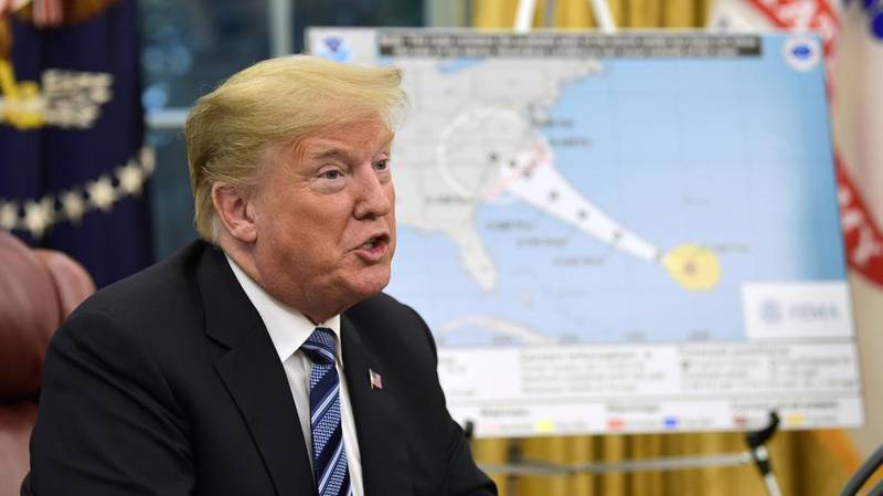 President Donald Trump skryter av egen innsats etter orkanen Maria på Puerto Rico for ett år siden, men får svar på tiltale.