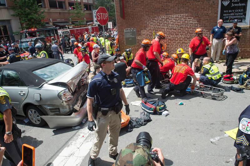 -- AFP PICTURES OF THE YEAR 2017 --

A woman is received first-aid after a car accident ran into a crowd of protesters in Charlottesville, VA on August 12, 2017. 
A picturesque Virginia city braced Saturday for a flood of white nationalist demonstrators as well as counter-protesters, declaring a local emergency as law enforcement attempted to quell early violent clashes.
 / AFP PHOTO / PAUL J. RICHARDS