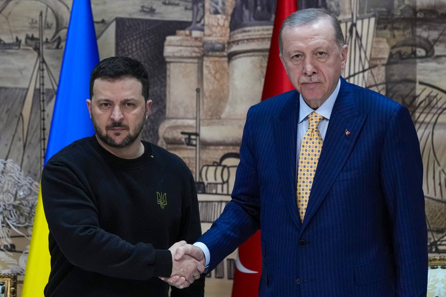 Turkish President Recep Tayyip Erdogan, right, shakes hands with Ukrainian President Volodymyr Zelenskyy at the end of a joint news conference following their meeting at Dolmabahce palace in Istanbul, Turkey, Friday, March 8, 2024. (AP Photo/Francisco Seco)