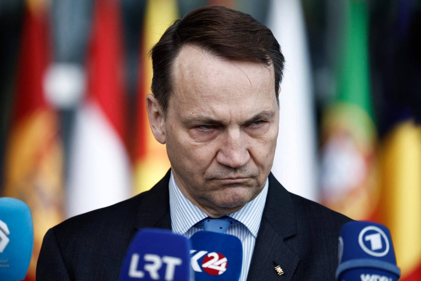 Polish Foreign Minister Radoslaw Sikorski gives a statement to the press ahead of a NATO foreign ministers' meeting at NATO headquarters in Brussel on April 3, 2024. (Photo by Kenzo TRIBOUILLARD / AFP)