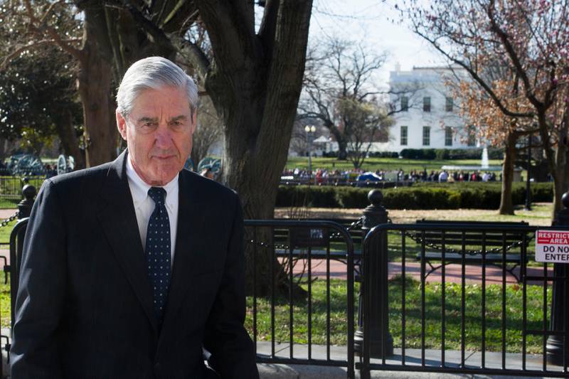With the White House in the background, right, Special Counsel Robert Mueller walks to St. John's Episcopal Church, for morning services, across from the White House, in Washington, Sunday, March 24, 2019. Mueller closed his long and contentious Russia investigation with no new charges, ending the probe that has cast a dark shadow over Donald Trump's presidency. (AP Photo/Cliff Owen)