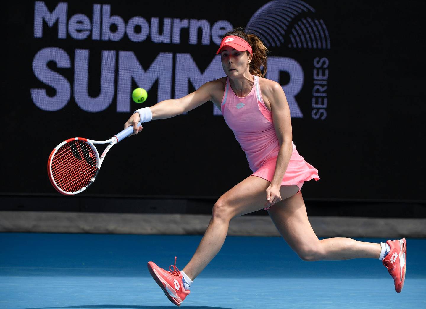 France's Alize Cornet makes a forehand return to Japan's Naomi Osaka during a tuneup tournament ahead of the Australian Open tennis championships in Melbourne, Australia, Tuesday, Feb. 2, 2021. (AP Photo/Andrew Brownbill)