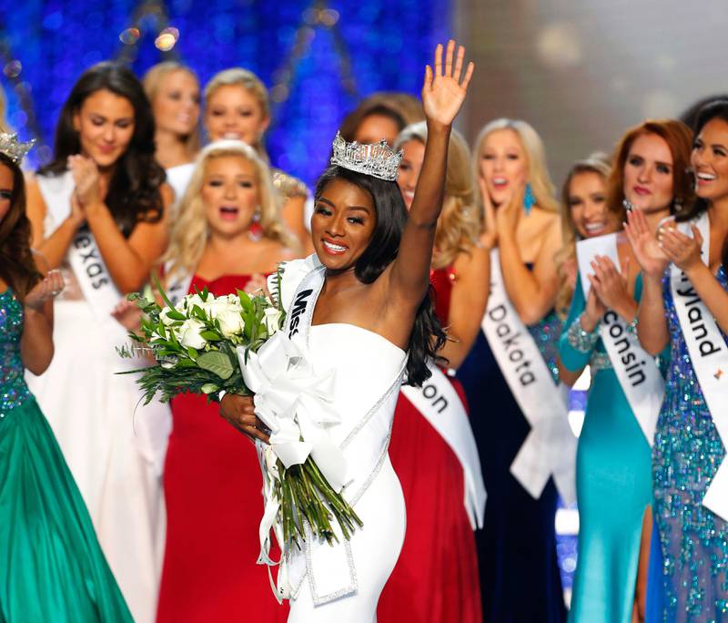 FILE - In this Sunday, Sept. 9, 2018 file photo, Miss New York Nia Franklin reacts after being named Miss America 2019 in Atlantic City, N.J.  Three black women are the reigning Miss USA, Miss Teen USA and Miss America. Chelsie Kryst completed the historic triple on Thursday, May 2, 2019 beside pageant winners 2019 Miss America Nia Franklin and recently crowned 2019 Miss Teen USA Kaliegh Garris. (AP Photo/Noah K. Murray, File)