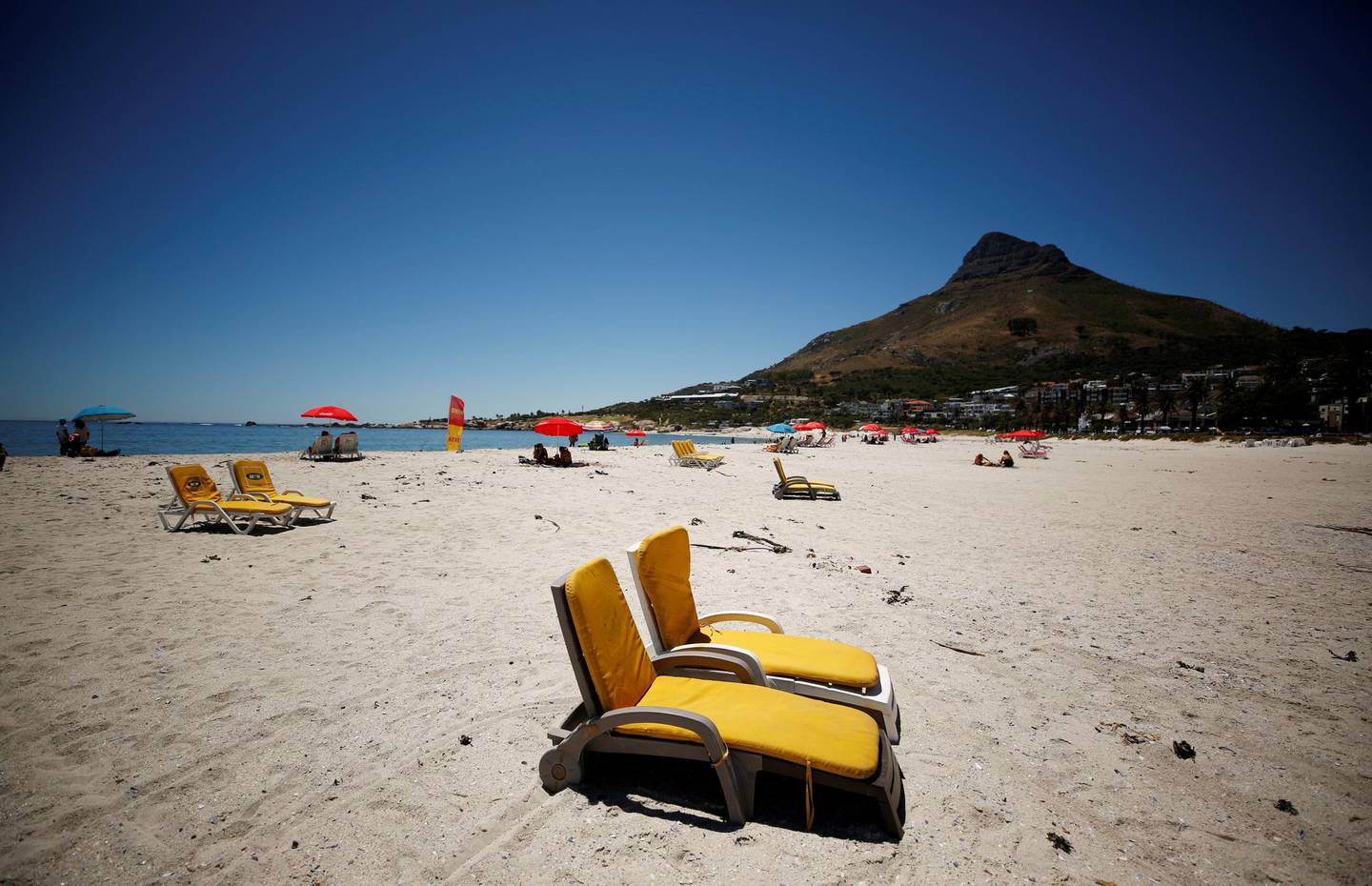 Empty chairs are seen at a beach after President Cyril Ramaphosa announced a relaxation of measures aimed at curbing the spread of the coronavirus disease (COVID-19) in Cape Town, South Africa, February, 2, 2021. REUTERS/Mike Hutchings.