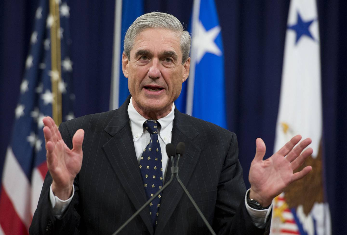 (FILES) In this file photo taken on August 1, 2013, former Federal Bureau of Investigation (FBI) Director Robert Mueller speaks during a farewell ceremony in Mueller's honor at the Department of Justice. - Donald Trump ripped into the Russia collusion probe November 7, 2018, calling it a "disgusting Witch Hunt" as the end of a two-month election hiatus freed Special Counsel Robert Mueller to resume issuing indictments and pressing for the president himself to answer questions. The end of a Justice Department quiet period for the probe was expected to open the door for Trump's nemesis to resume filing charges and issuing subpoenas, with the president widely believed under investigation for possible obstruction of justice. (Photo by Saul LOEB / AFP)