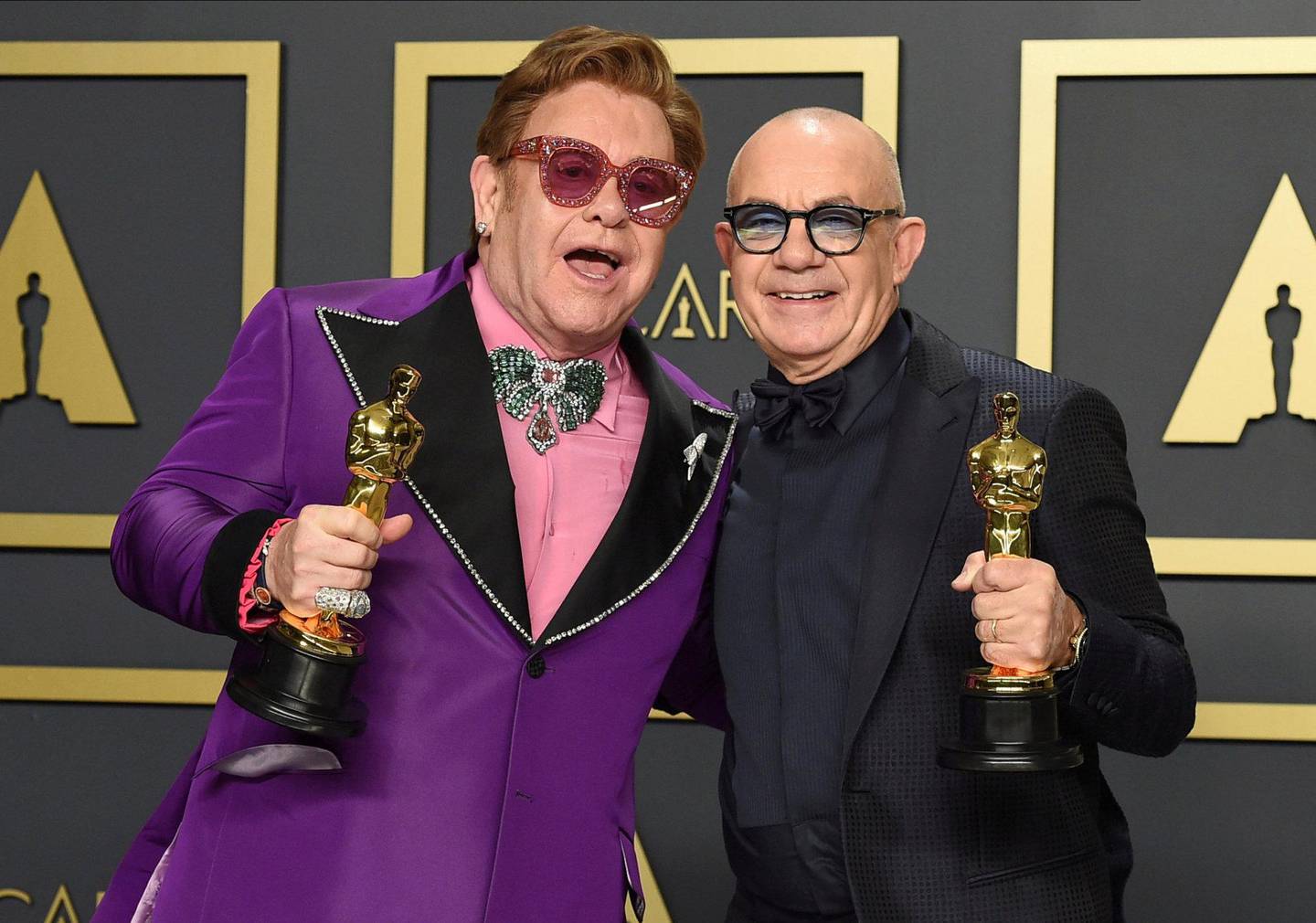 Elton John og Bernie Taupin fikk Oscar for beste filmmelodi i februar i år, for «(I’m Gonna) Love Me Again» fra «Rocket­­man». Foto: Jordan Strauss/AP/NTB