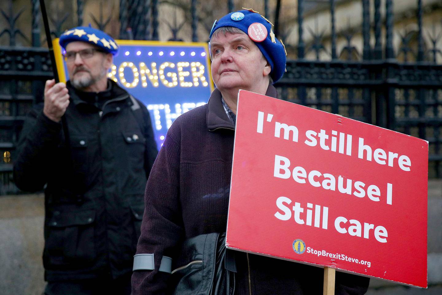 Anti-Brexit protestors stand outside the Houses of Parliament in London, Wednesday, Jan. 22, 2020. Britain are scheduled to leave the European Union on Jan. 31, 2020. (Hollie Adams via AP)