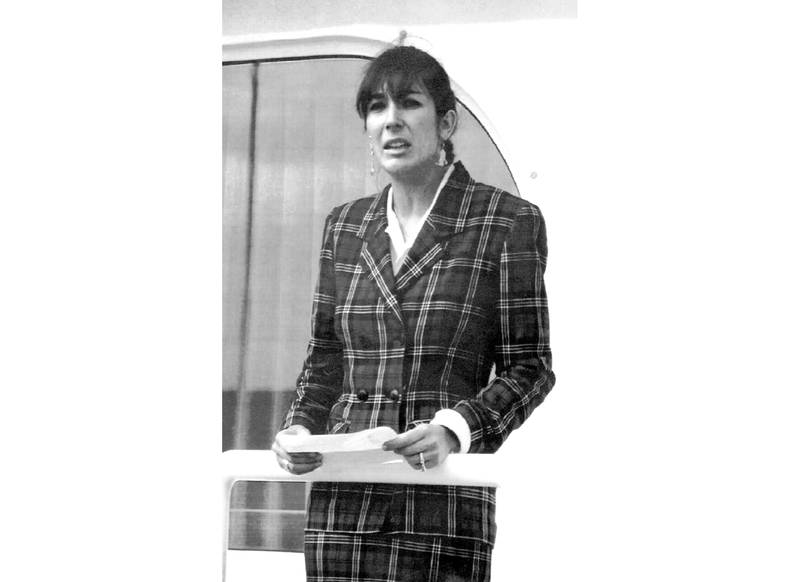 FILE - In this Nov. 7, 1991, file photo Ghislaine Maxwell, daughter of late British publisher Robert Maxwell, reads a statement in Spanish in which she expressed her family's gratitude to the Spanish authorities, aboard the "Lady Ghislaine" in Santa Cruz de Tenerife. Maxwell, a British socialite who was accused by many women of helping procure underage sex partners for Jeffrey Epstein, has been arrested in New Hampshire, the FBI said Thursday, July 2, 2020. (AP Photo/Dominique Mollard, File)