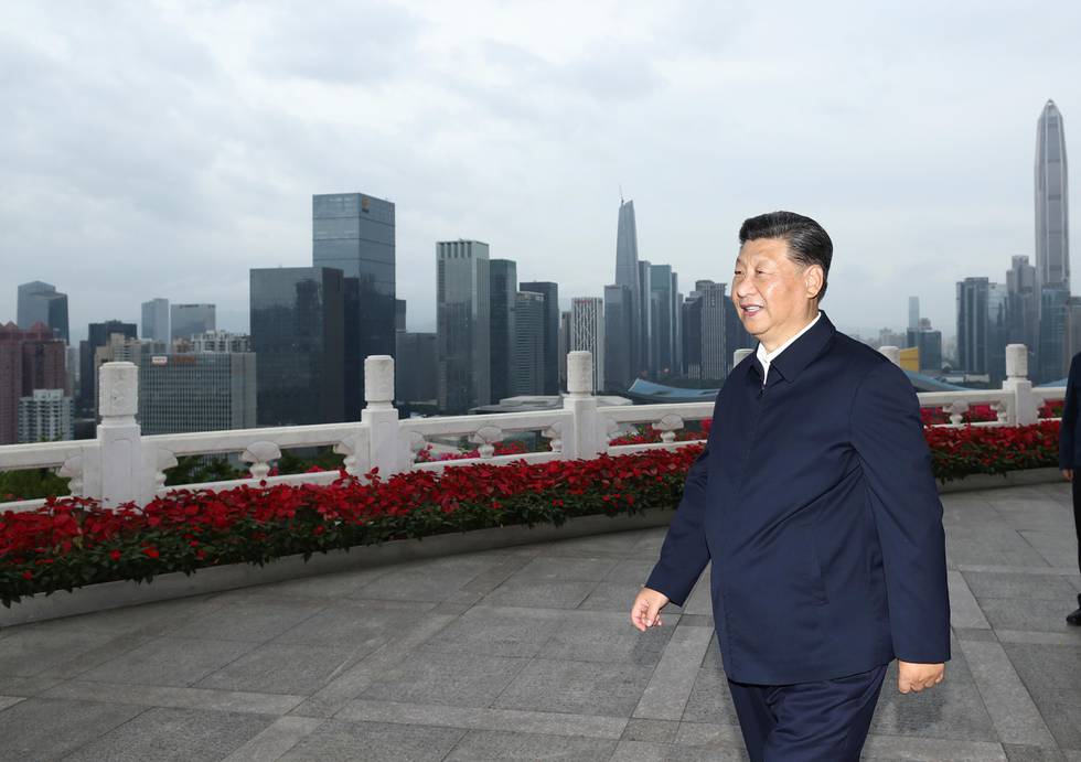 In this photo released by China's Xinhua News Agency, Chinese President Xi Jinping looks at the skyline of Shenzhen during a visit to commemorate the 40th anniversary of the establishment of the Shenzhen Special Economic Zone in Shenzhen in southern China's Guangdogn Province, Wednesday, Oct. 14, 2020. Xi promised Wednesday new steps to back development of China's biggest tech center, Shenzhen, amid a feud with Washington that has disrupted access to U.S. technology and is fueling ambitions to create Chinese providers. (Ju Peng/Xinhua via AP)
