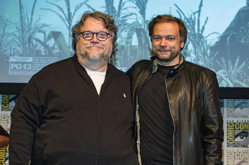 SAN DIEGO, CALIFORNIA - JULY 20: Producer Guillermo del Toro (L) and director André Øvredal of "Scary Stories To Tell In The Dark" pose on stage at Horton Grand Theater on July 20, 2019 in San Diego, California. (Photo by Daniel Knighton/Getty Images for CBS Films)