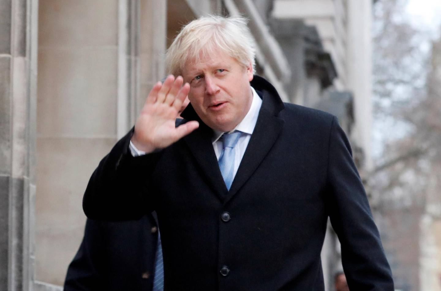 Britain's Prime Minister Boris Johnson waves as he arrives at a polling station, at the Methodist Central Hall, to vote in the general election in London, Britain, December 12, 2019. REUTERS/Thomas Mukoya