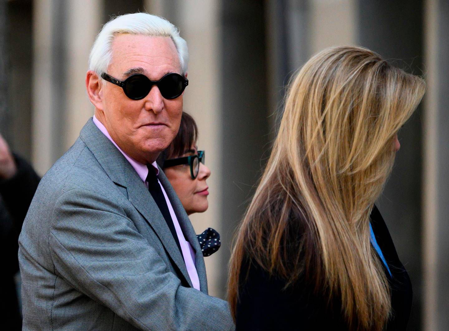 (FILES) In this file photo taken on November 5, 2019 Roger Stone, former adviser to US President Donald Trump, enters the E. Barrett Prettyman United States Court House with his wife Nydia (C) and daughter Adria Stone(R) in Washington, DC. - Republican political consultant Roger Stone requested a new trial February 14, 2020, just days after President Donald Trump's criticism of his proposed jail sentence sparked an uproar over political influence in the justice system. (Photo by Andrew CABALLERO-REYNOLDS / AFP)
