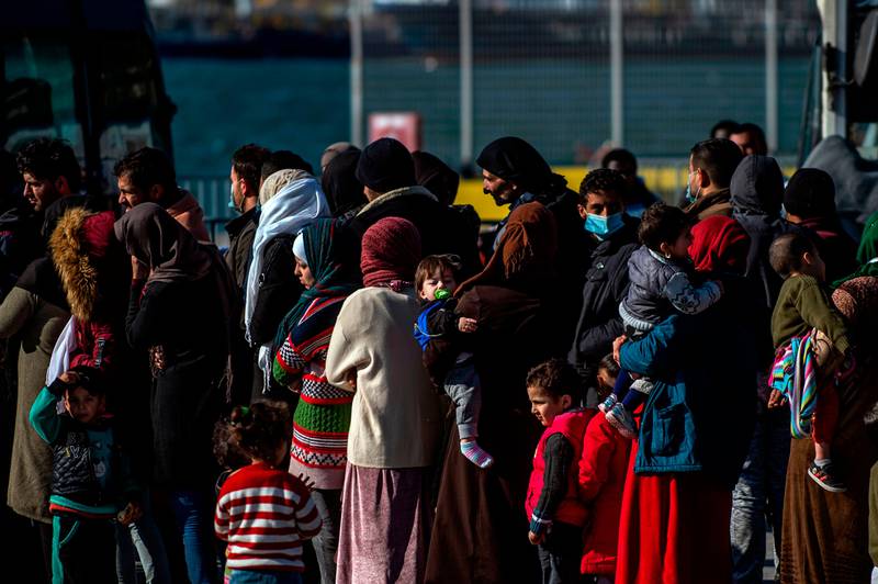 Migrants disembarked in the last three days on Lesbos Island, waits in the port of Lesbos, Greece,  on March 03, 2020.

. - Greece was on a state of alert on March 1, 2020 as it faced an influx of thousands of migrants seeking to cross the border from Turkey, with locals fearing a new immigration crisis. More than 13,000 migrants have gathered on the Turkish side of the river which runs 200 kilometres (125 miles) along the frontier and separates them from Greece and therefore the European Union. The flow of migrants from Turkey has triggered EU fears of a re-run of the 2015 migrant emergency when Greece became the main EU entry point for a million migrants, most of them refugees fleeing the Syrian civil war. (Photo by ANGELOS TZORTZINIS / AFP)