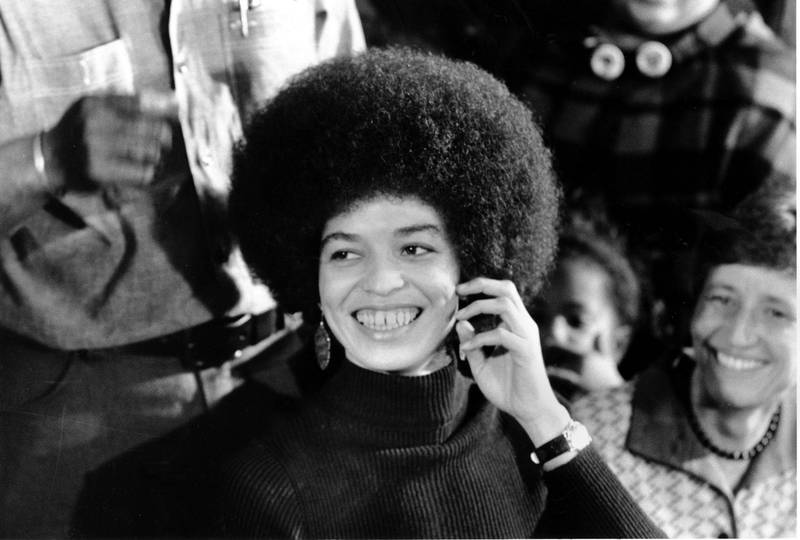 Angela Davis, the self-acclaimed communist and revolutionary, smiles at a news conference in her San Jose headquarters on Feb. 25, 1972, a day after she is released on $102,500 bail. Davis, who is to begin trial on murder, conspiracy and kidnap charges, has been in jail for 16 months after her arrest in connection with the escape attempt at Marin County Courthouse shoot-out in August, 1970. (AP Photo)