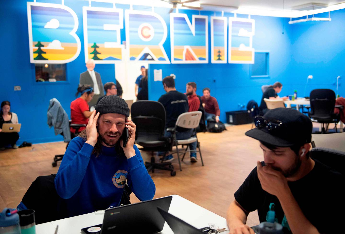 Phone bank volunteers call potential voters from the Colorado campaign office of Democratic presidential candidate Vermont Senator Bernie Sanders on Super Tuesday, March 3, 2020 in Denver, Colorado. - Fourteen states and American Samoa are holding presidential primary elections, with over 1400 delegates at stake. Americans vote Tuesday in primaries that play a major role in who will challenge Donald Trump for the presidency, a day after key endorsements dramatically boosted Joe Biden's hopes against surging leftist Bernie Sanders. The backing of Biden by three of his ex-rivals marked an unprecedented turn in a fractured, often bitter campaign. (Photo by Jason Connolly / AFP)