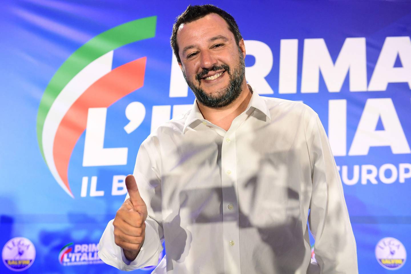 Italian Deputy Prime Minister and Interior Minister Matteo Salvini gives a "thumbs up" during a press conference in the Lega headquarters in northern Milan following the results of the European parliamentary elections, on May 27, 2019. - Matteo Salvini's anti-migrant League party won the most votes on May 26 in European elections in Italy, marking a historic success for the far-right. With over 99 percent of ballots counted, the League won 34.3 percent, compared to just six percent in the 2014 EU elections and 17 percent in the Italian general election last year. (Photo by Miguel MEDINA / AFP)