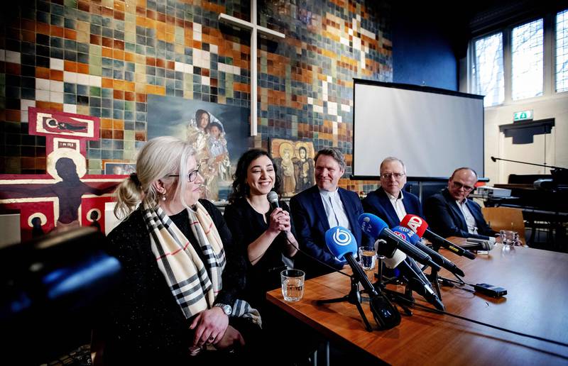 Armenian Hayarpi Tamrazyan (2nd L) speaks during a press conference in De Bethelkerk on January 30, 2019, after a continious church services was stopped. - A Dutch church said on January 30, 2019, it will finally halt a marathon three-month-long religious service aimed at stopping the expulsion of an Armenian family after a parliamentary deal allowing them to stay. The Tamrazyan family has been sheltering at the Bethel church in The Hague since October 2018, fighting their deportation by taking advantage of a Dutch law that authorities cannot enter while a service is underway. (Photo by Robin van Lonkhuijsen / ANP / AFP) / Netherlands OUT