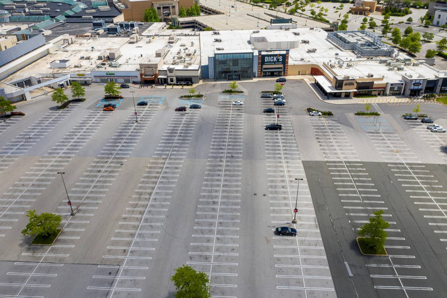 Mostly empty parking lots stand next to the King of Prussia Mall which remains closed due to the ongoing outbreak of the coronavirus disease (COVID-19) in Upper Merion Township, Pennsylvania U.S., May 21, 2020. REUTERS/Lucas Jackson