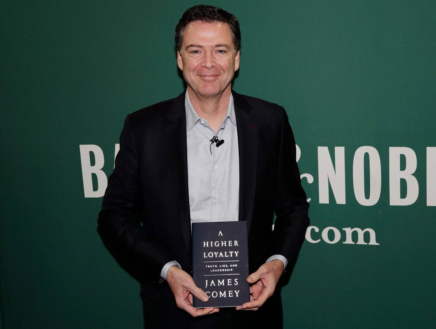 Former FBI director James Comey poses for photographs at a Barnes & Noble book store before speaking Wednesday, April 18, 2018, in New York. (AP Photo/Frank Franklin II)