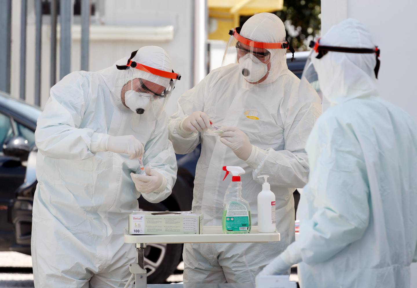 Health workers wearing protective gears keep swabs in tubes taken from drivers, as the spread of coronavirus disease (COVID-19) continues, in Giugliano in Campania, Italy, April 6, 2020. REUTERS/Ciro De Luca