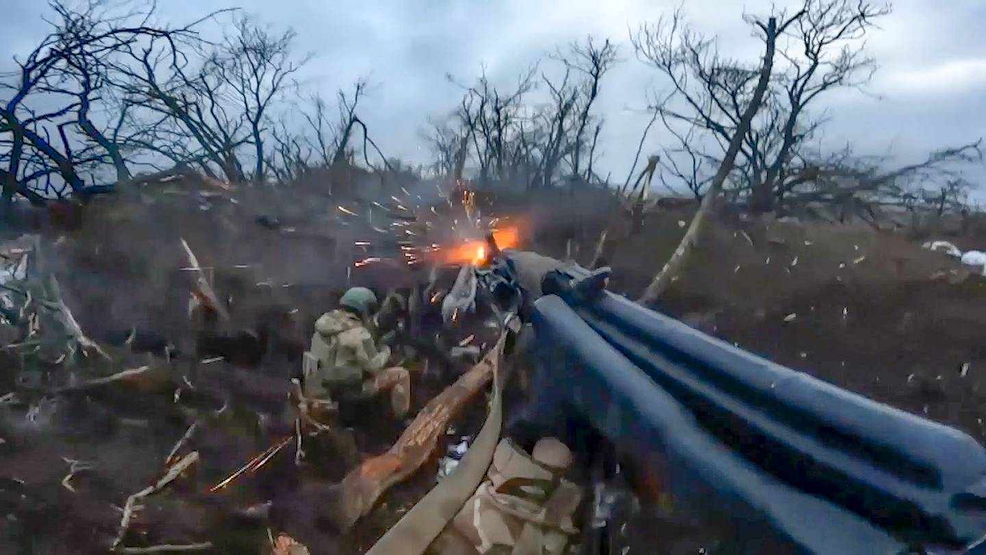 In this photo taken from video and released by the Russian Defense Ministry Press Service on Thursday, April 4, 2024, Russian soldiers at an undisclosed location in Ukraine. (Russian Defense Ministry Press Service via AP)