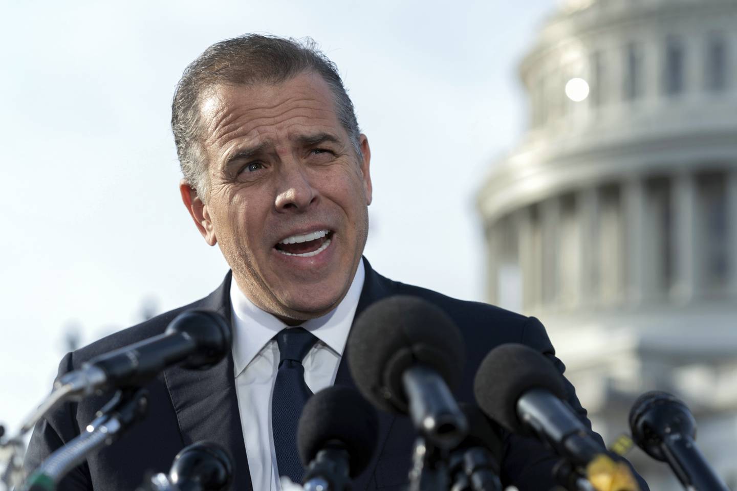 Hunter Biden, son of President Joe Biden, talks to reporters at the U.S. Capitol, in Washington, Wednesday, Dec. 13, 2023. Hunter Biden lashed out at Republican investigators who have been digging into his business dealings, insisting outside the Capitol he will only testify before a congressional committee in public. (AP Photo/Jose Luis Magana)
