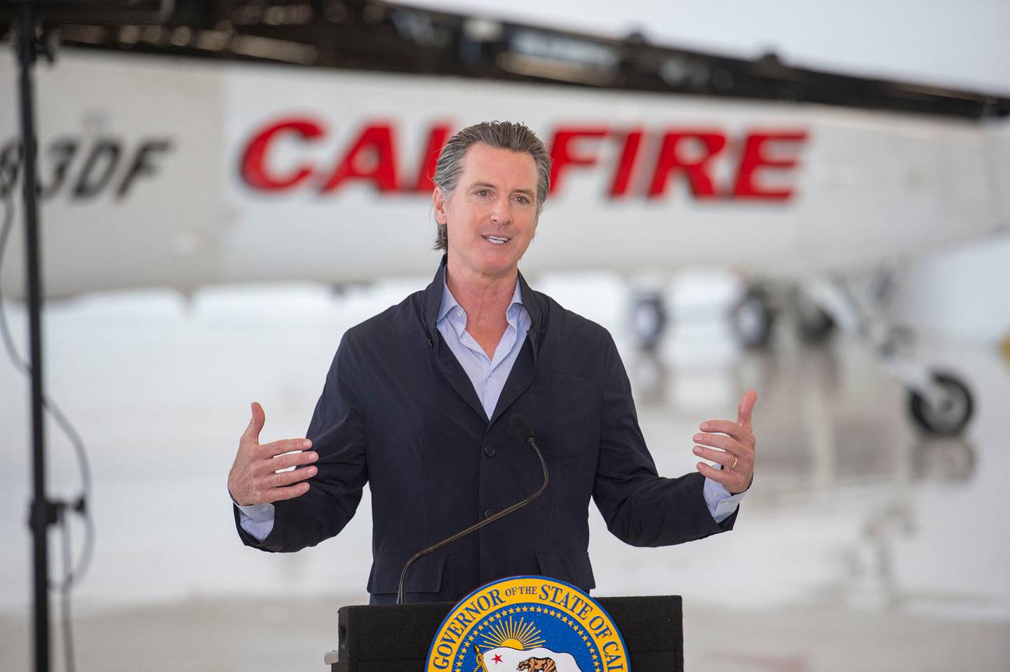 California Gov. Gavin Newsom visits the California Department of Forestry and Fire Protection's McClellan Reload Base in Sacramento, Calif., Thursday, July 9, 2020, to discuss the state's new efforts to protect emergency personnel and evacuees from COVID-19 during wildfires. (AP Photo/Hector Amezcua, Pool)