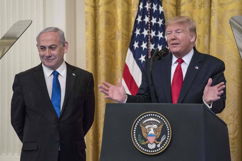 TOPSHOT - WASHINGTON, DC - JANUARY 28: U.S. President Donald Trump and�Israeli Prime Minister Benjamin Netanyahu�participate in a joint statement in the East Room of the White House on January 28, 2020 in Washington, DC. The news conference was held to announce the Trump administration's plan to resolve the Israeli-Palestinian conflict.   Sarah Silbiger/Getty Images/AFP (Photo by Sarah Silbiger / GETTY IMAGES NORTH AMERICA / AFP)