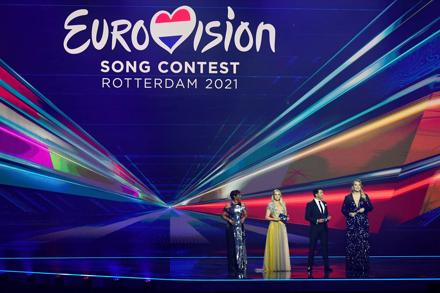 Presenters Dutch singers Edsilia Rombley, Chantal Janzen, Jan Smit and Dutch influential YouTuber Nikkie de Jager are seen on stage during first semi-final of the 2021 Eurovision Song Contest in Rotterdam, Netherlands May 18, 2021. REUTERS/Piroschka Van de Wouw