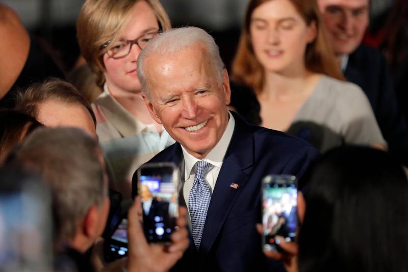Democratic presidential candidate former Vice President Joe Biden poses for photos at a primary night election rally in Columbia, S.C., Saturday, Feb. 29, 2020. (AP Photo/Gerald Herbert)