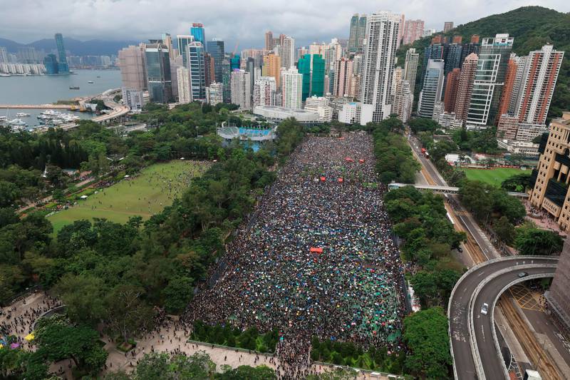 Protesters gather during a rally at Victoria Park in Hong Kong on Sunday, Aug. 18, 2019. Thousands of people streamed into a park in central Hong Kong on Sunday for what organizers hope will be a peaceful demonstration for democracy in the semi-autonomous Chinese territory. (Apple Daily via AP)