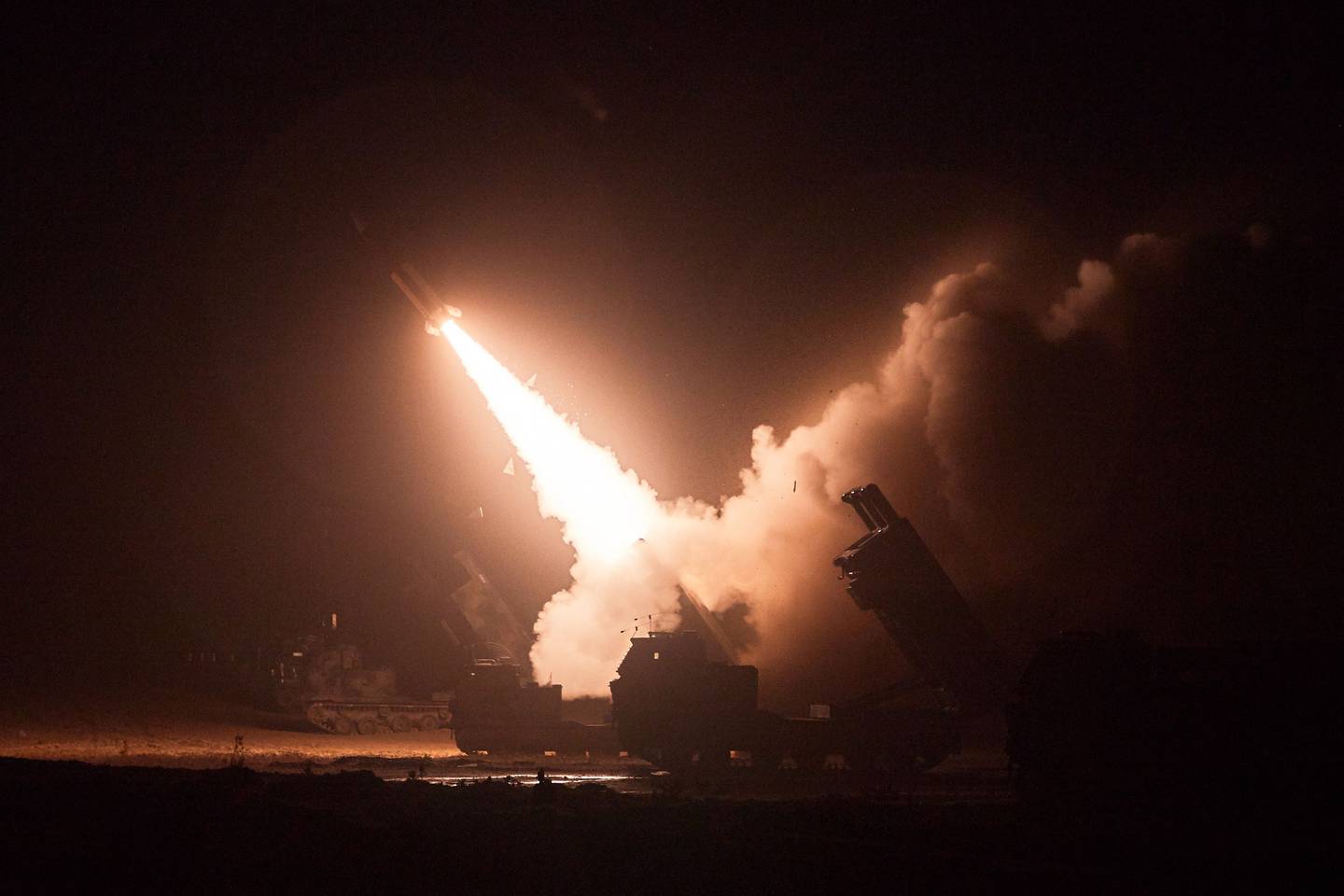 This handout photo taken on June 6, 2022 and released by South Korea's Joint Chiefs of Staff via Yonhap news agency in Seoul shows the Army Tactical Missile System (ATACMS) firing a missile from an undisclosed location on South Korea's east coast during a South Korea-US joint live-fire exercise aimed to counter North Korea’s missile test. - South Korea and the United States fired eight ballistic missiles on June 6 in response to North Korean weapons tests the previous day, Seoul's military said. (Photo by Handout / South Korea's Joint Chiefs of Staff / AFP) / RESTRICTED TO EDITORIAL USE - MANDATORY CREDIT "AFP PHOTO / South Korea's Joint Chiefs of Staff" - NO MARKETING NO ADVERTISING CAMPAIGNS - DISTRIBUTED AS A SERVICE TO CLIENTS