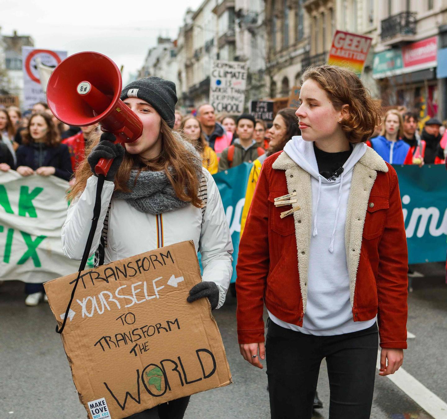 Climate activists Adelaide Charlier (L) and Climate activist Anuna De Wever take part in a demonstration as part of a global day of student protests aiming to push world leaders into action on climate change on March 15, 2019, in Brussels. - The worldwide youth protests were inspired by a Swedish teen activist who camped out in front of parliament in Stockholm last year to demand action from world leaders on global warming. (Photo by PAUL-HENRI VERLOOY / BELGA / AFP)