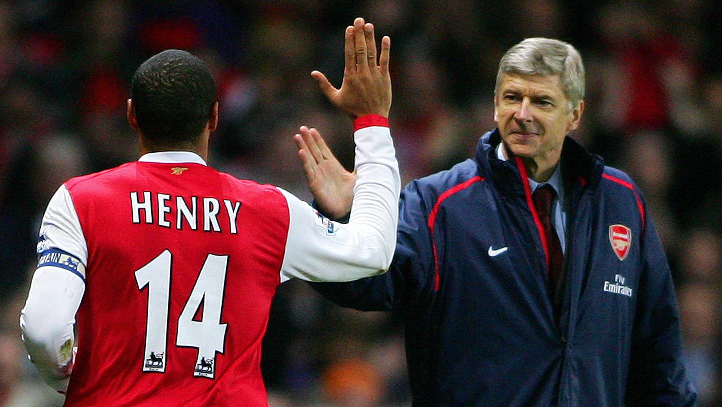 (FILES) In this file photo taken on January 02, 2007 Arsenal's Captain, Frenchman Thierry Henry (L) celebrates with countryman manager Arsene Wenger (R) after scoring from a penalty shot during their Premiership match against Charlton at home to Arsenal, 02 January 2006. 
Arsene Wenger will bring his 22-year stay in charge of Arsenal to a close at the end of the season, the Frenchman announced on April 20, 2018. / AFP PHOTO / Carl DE SOUZA