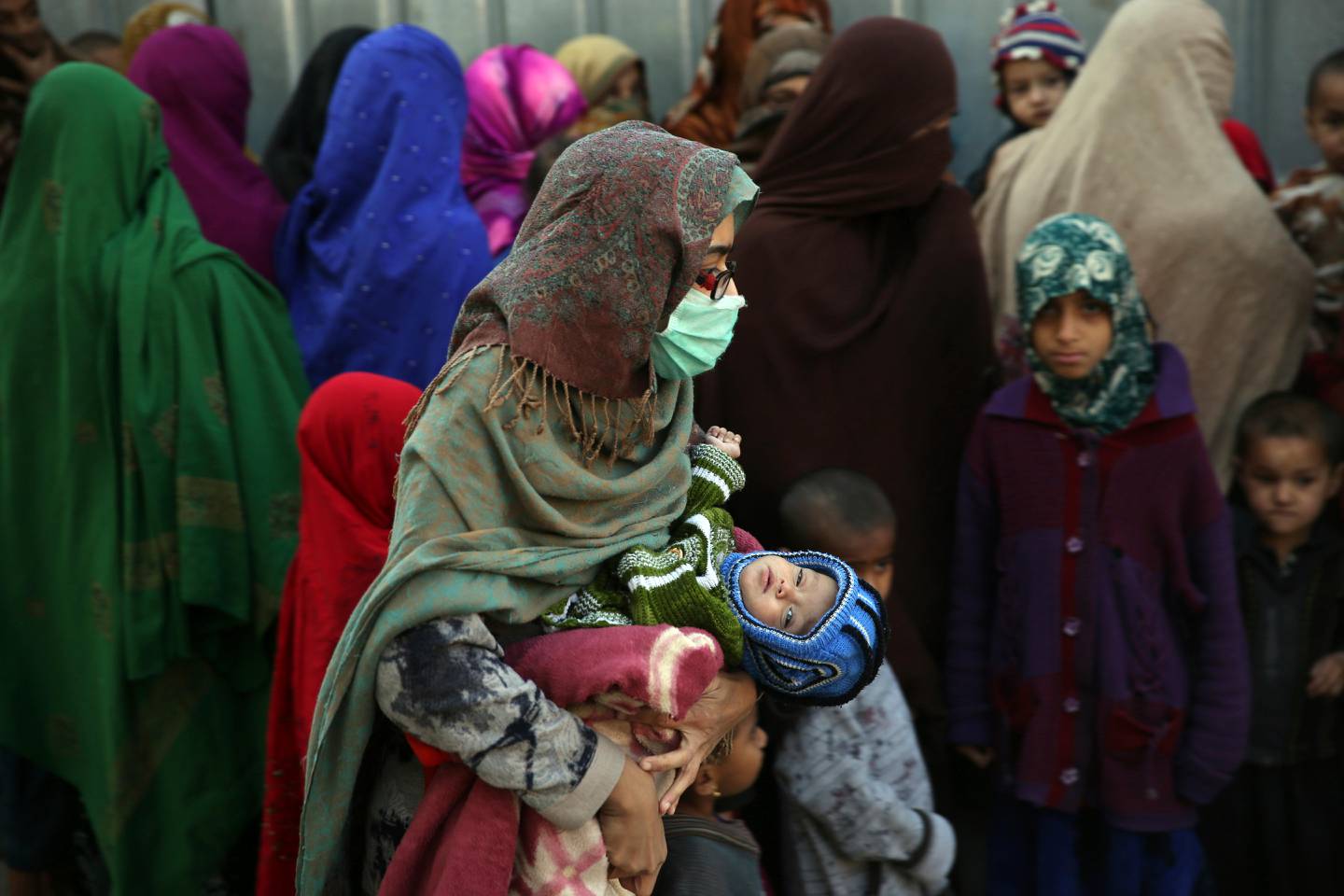 Family members of Islamic State militants either arrested or surrounded up to the Afghan government are presented to media in Kabul, Afghanistan, Saturday, Dec. 21, 2019.  The country's intelligence service says Saturday that there are more than 75 women and 159 children most of them form foreign countries in the custody of the agency known as the National Deteriorate for Security.  (AP Photo/Rahmat Gul)