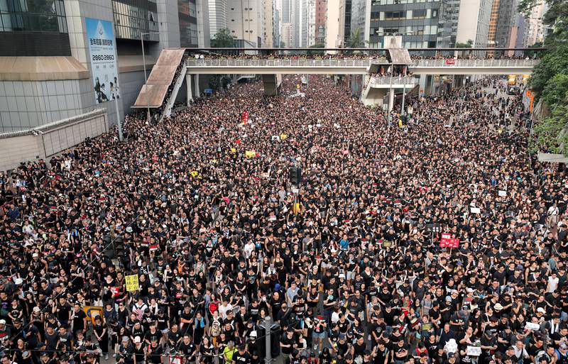 FILE PHOTO: Protesters attend a demonstration demanding Hong Kong's leaders step down and withdraw the extradition bill, in Hong Kong, China, June 16, 2019. REUTERS/Tyrone Siu/File Photo    To match Special Report HONGKONG-DEMOCRACY/ACTIVISTS