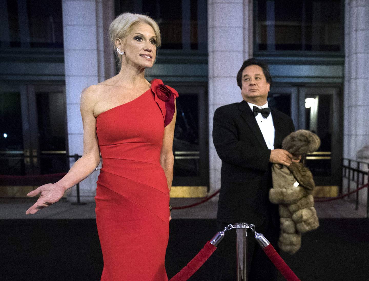 (FILES) In this file photo taken on January 19, 2017, senior advisor to President-elect Donald Trump, Kellyanne Conway (L), accompanied by her husband George Conway (C), speaks to reporters as they arrives at Union Station for a dinner for campaign donors in Washington. DC. - Who really gets under Donald Trump's skin? A man who has been dead since last year and another whom the president says he hardly knows. At least that's the bizarre picture painted by Trump this week in angry rants at the late senator John McCain and a Washington lawyer called George Conway. (Photo by Drew Angerer / GETTY IMAGES NORTH AMERICA / AFP)