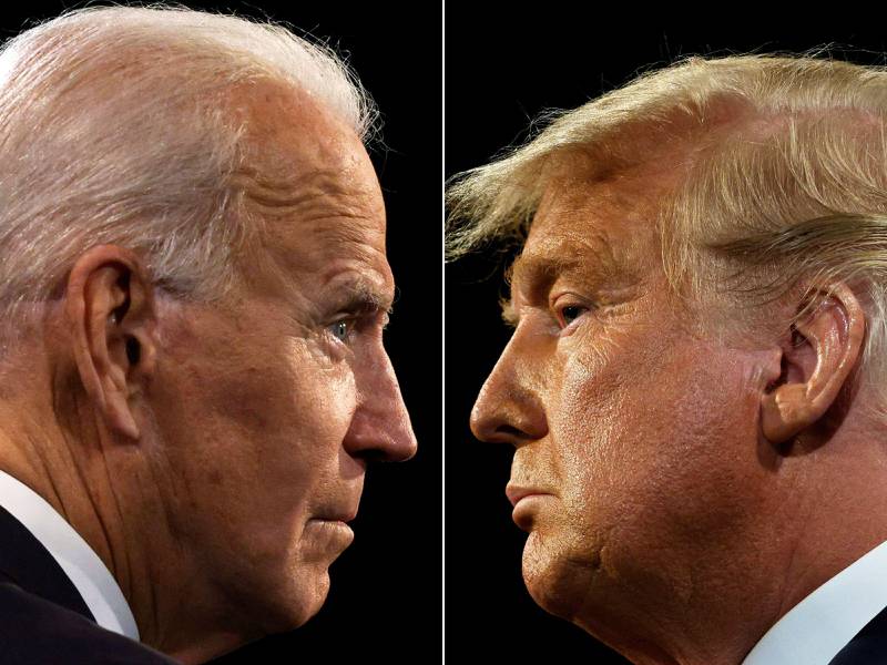 (COMBO) This combination of file pictures shows US President Donald Trump (R) and Democratic Presidential candidate Joe Biden during the final presidential debate at Belmont University in Nashville, Tennessee, on October 22, 2020. - President Donald Trump said on January 8, 202, he would not attend his successor Joe Biden's inauguration after repeatedly rejecting the election result as a fraud and his supporters violently storming the US Capitol in Washington. "To all of those who have asked, I will not be going to the Inauguration on January 20th," Trump tweeted, without giving a reason for not attending. (Photos by JIM BOURG / AFP)