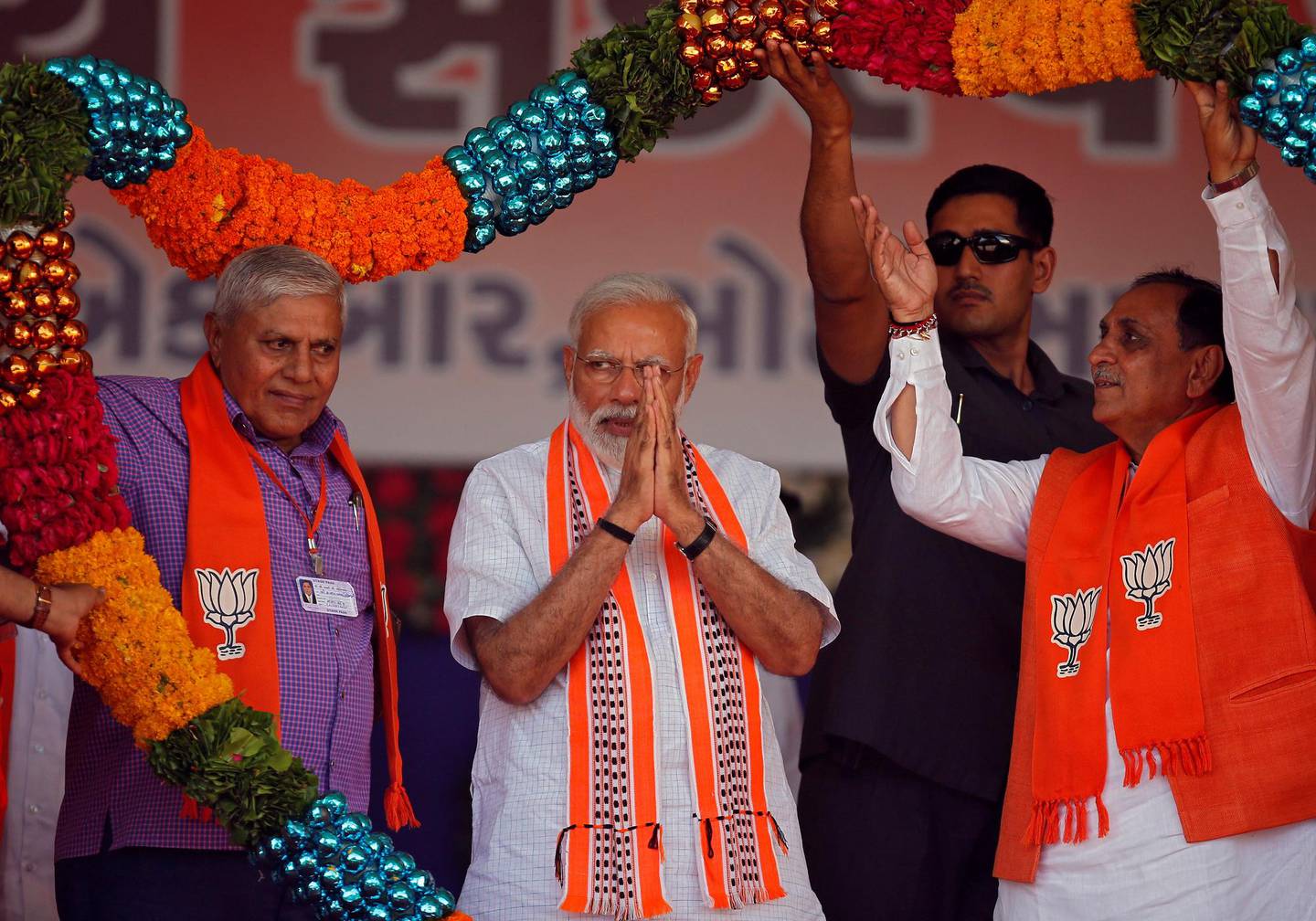 India's Prime Minister Narendra Modi gestures as he is presented with a garland during an election campaign rally in Junagadh, Gujarat, India, April 10, 2019. REUTERS/Amit Dave