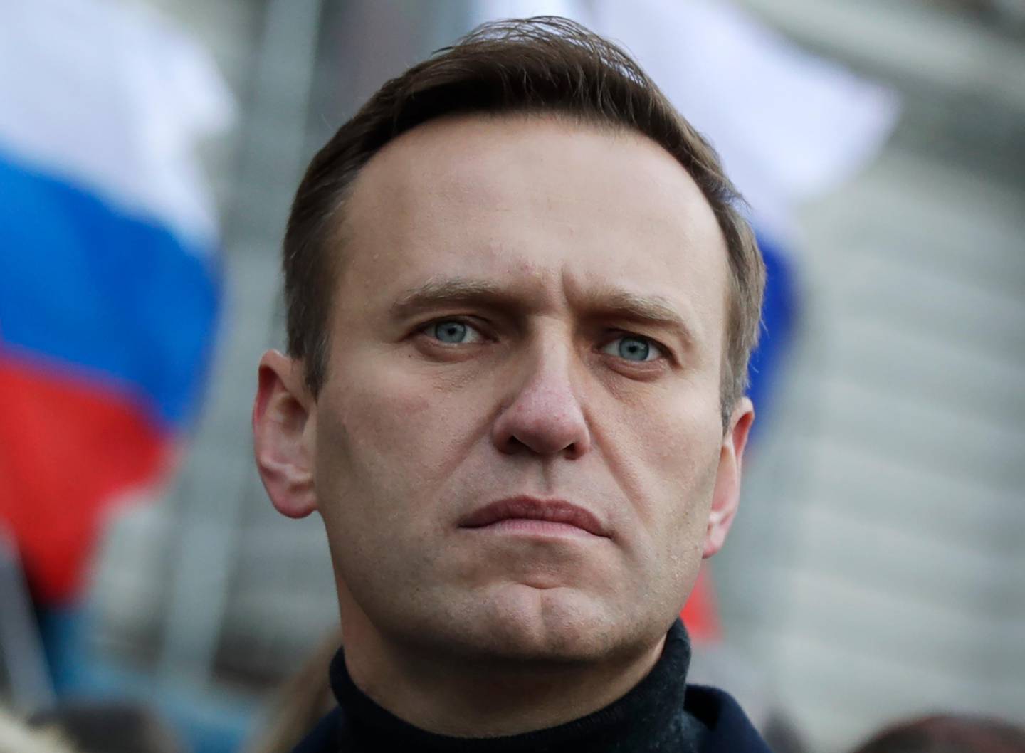 FILE - In this file photo taken on Saturday, Feb. 29, 2020, Russian opposition activist Alexei Navalny takes part in a march in memory of opposition leader Boris Nemtsov in Moscow, Russia. Navalny's team has backed a strike by election workers who don't want to subject themselves to the risk of contracting the coronavirus at polling stations. But the strikers admit they haven't gained much traction -- an open letter announcing the strike has so far gathered a little over 500 signatures. (AP Photo/Pavel Golovkin, File)