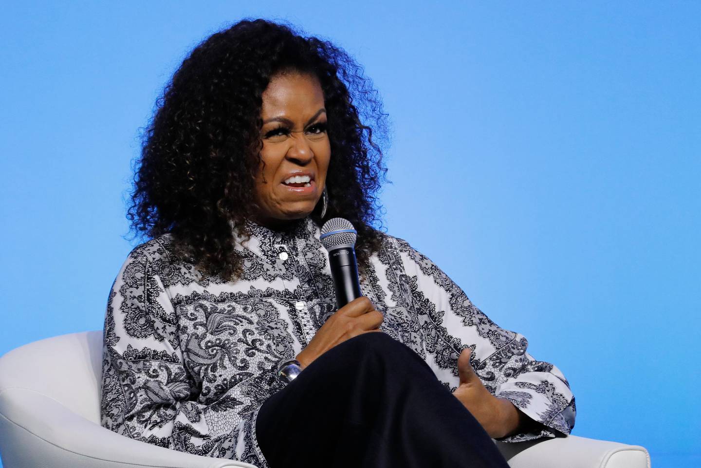 Former U.S. fist lady Michelle Obama reacts as she speaks during an event for Obama Foundation in Kuala Lumpur, Malaysia, Thursday, Dec. 12, 2019. Obama and actress Julia Roberts attend inaugural Gathering of Rising Leaders in the Asia Pacific organized by the Obama Foundation. (AP Photo/Vincent Thian)