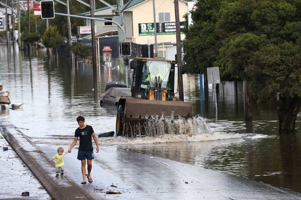 A view of a flooded road following heavy rains in Lismore, New South Wales, Australia March 2, 2022. AAP Image/Jason O'Brien via REUTERS  ATTENTION EDITORS - THIS IMAGE WAS PROVIDED BY A THIRD PARTY. NO RESALES. NO ARCHIVE. AUSTRALIA OUT. NEW ZEALAND OUT.